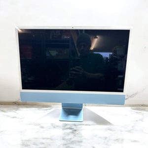 Blue 24‑inch iMac with Apple M1 chip.